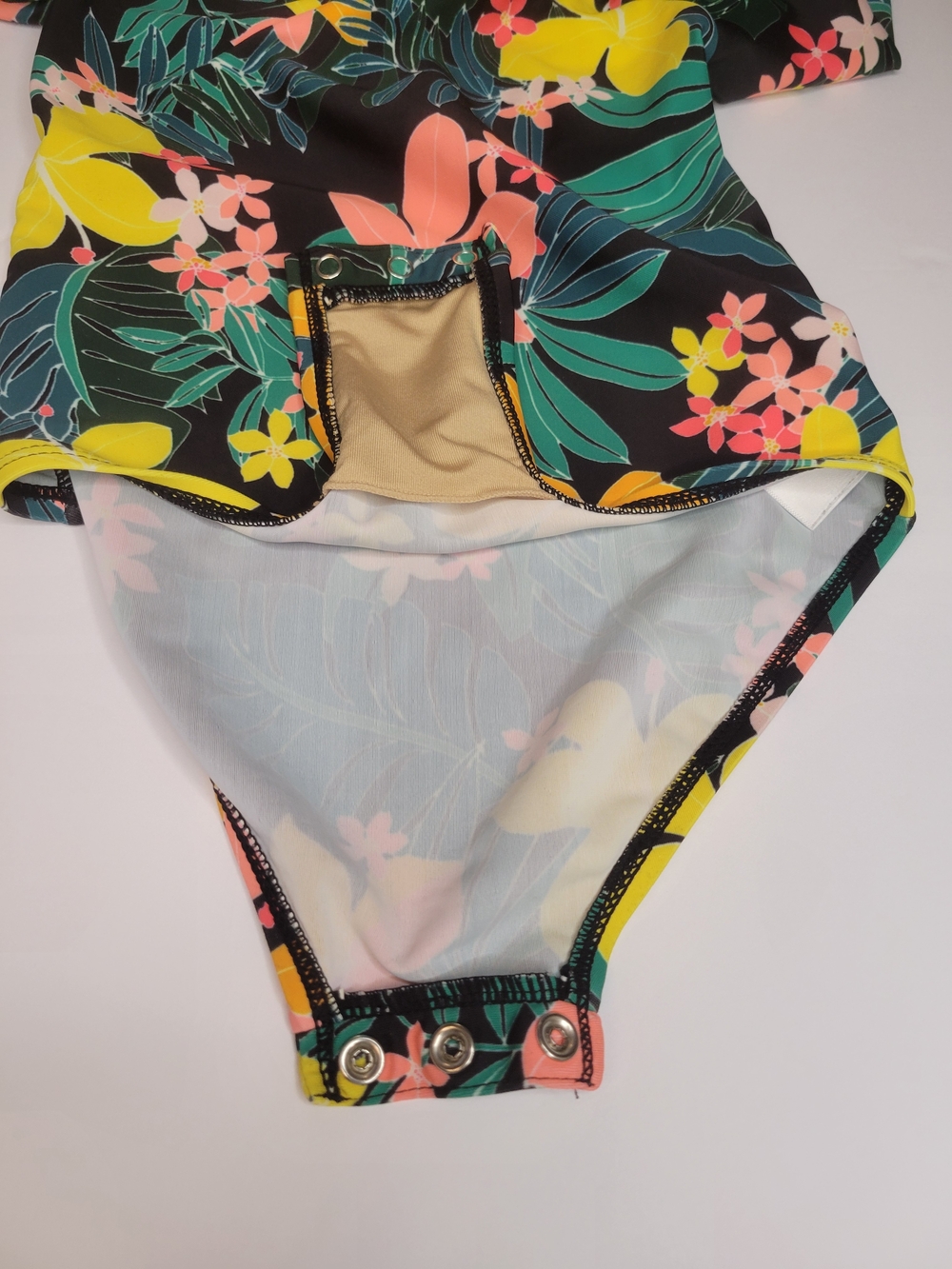 Old Navy toddler girl's long-sleeve, one-piece swimsuit featuring a black floral - Picture 4 of 6
